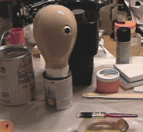 Painted head with supplies used.